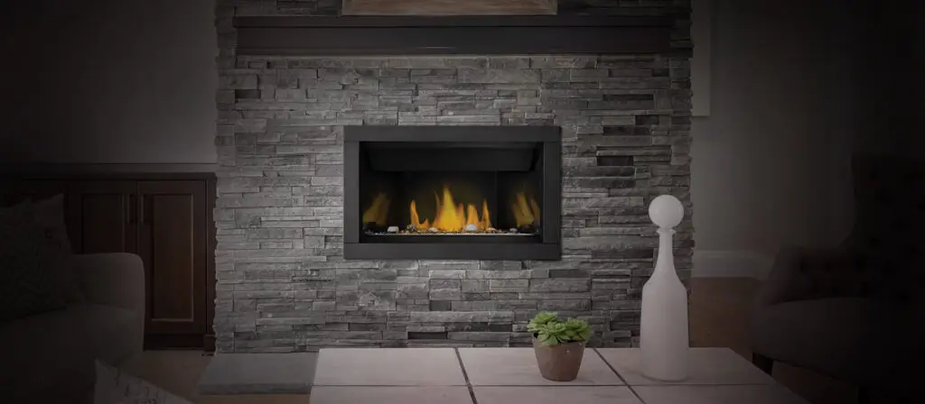 Modern gas fireplace set in stone wall living room